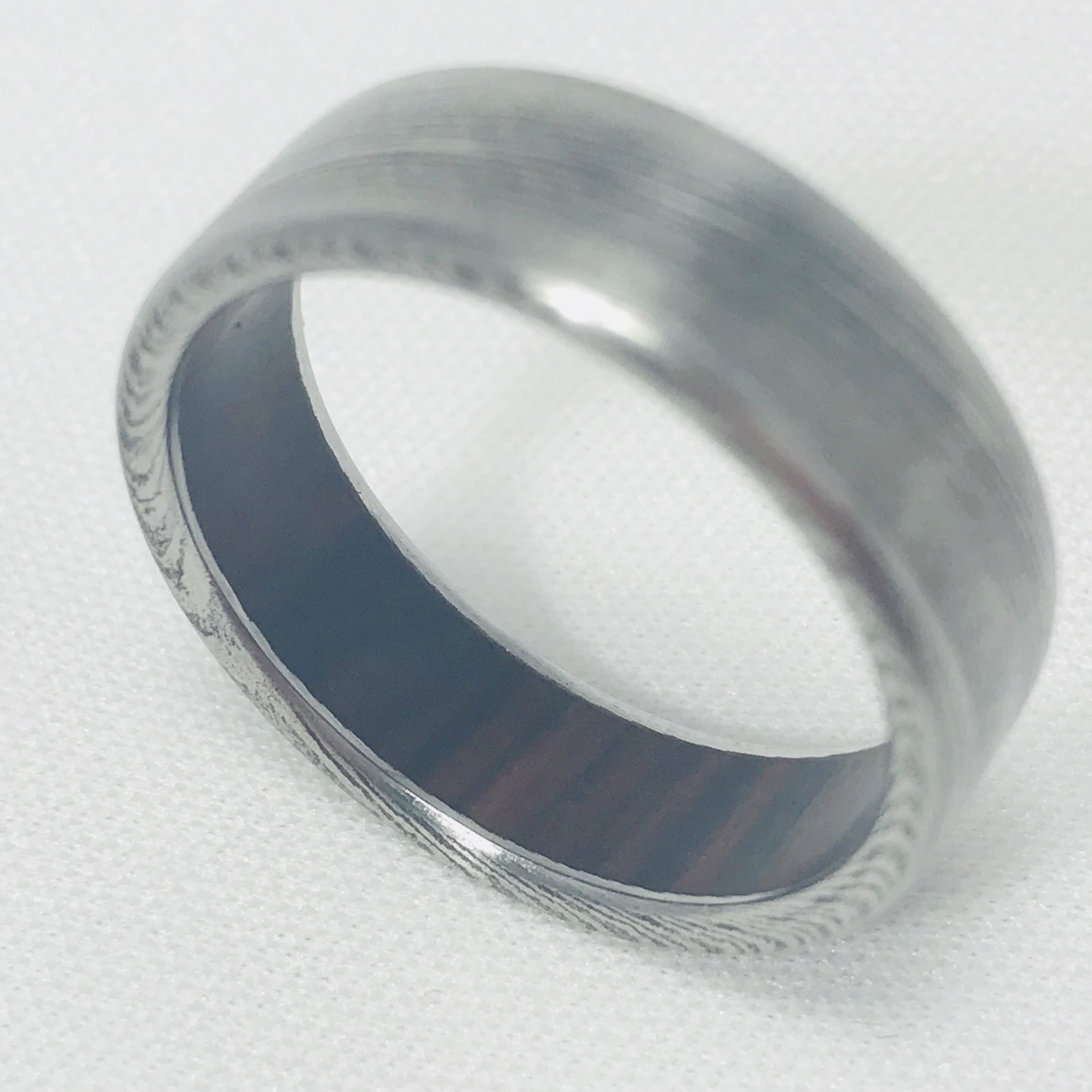 damascus wedding band with wood inside